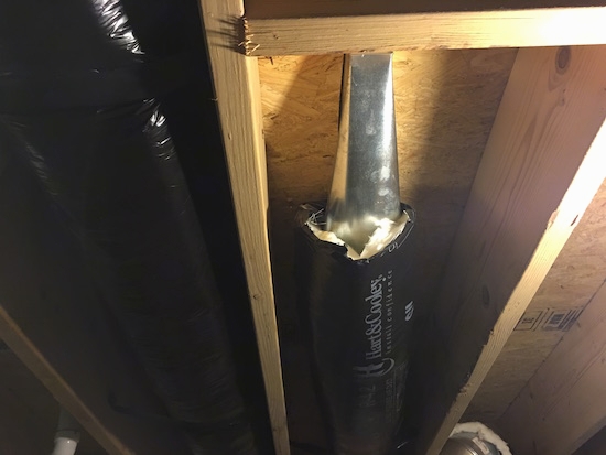 Flex duct work in a basement ceiling with the fiberglass ends exposed to the air