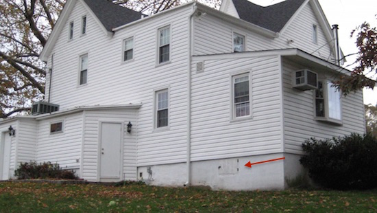 The backside of a white house built in the 1800s